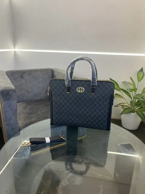 Gucci Imported leather laptop bag with double zip back zip and strap black gold