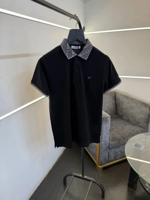 Versace black imported polo tshirt with brand buttons and knitted collar with sleeves
